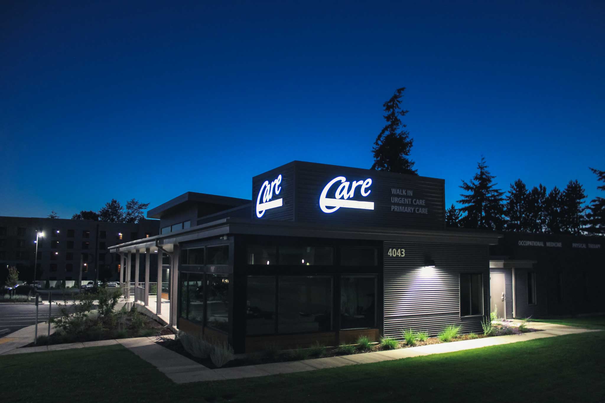 care-medical-group-illuminated-channel-letters-building-sign-night