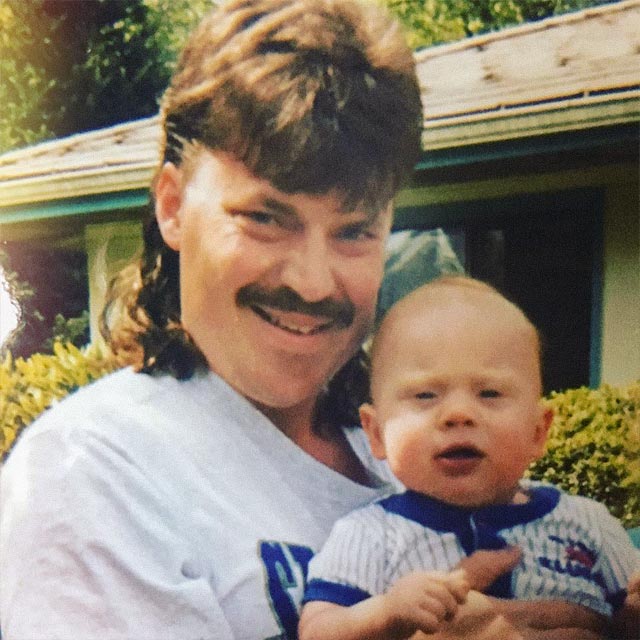 Dan Townsend holding his son
